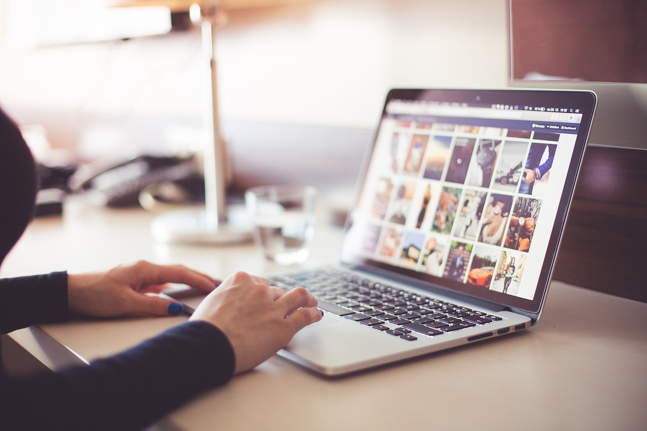 Hands at a laptop — SEO and content work
